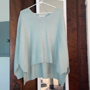 Pale blue one size sweater.